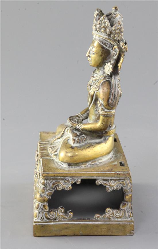A Chinese gilt bronze figure of Amitayus, Qianlong mark and period, dated 1770, height 19cm, lacking aureole